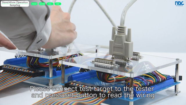 Connecting the cable to the jig for creating the test data. 